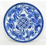 A late 17th/18th century Japanese Arita porcelain charger, painted in underglaze blue with series of