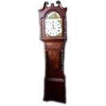 An early to mid-19th century mahogany and crossbanded longcase clock, the repainted arch dial
