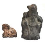 An 19th century Chinese carved soapstone figure of a chi chi, length 4.25cm, and an unusual black