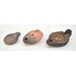 A group of three Roman pottery lamps, the largest length 10.5cm.Additional InformationThe largest is