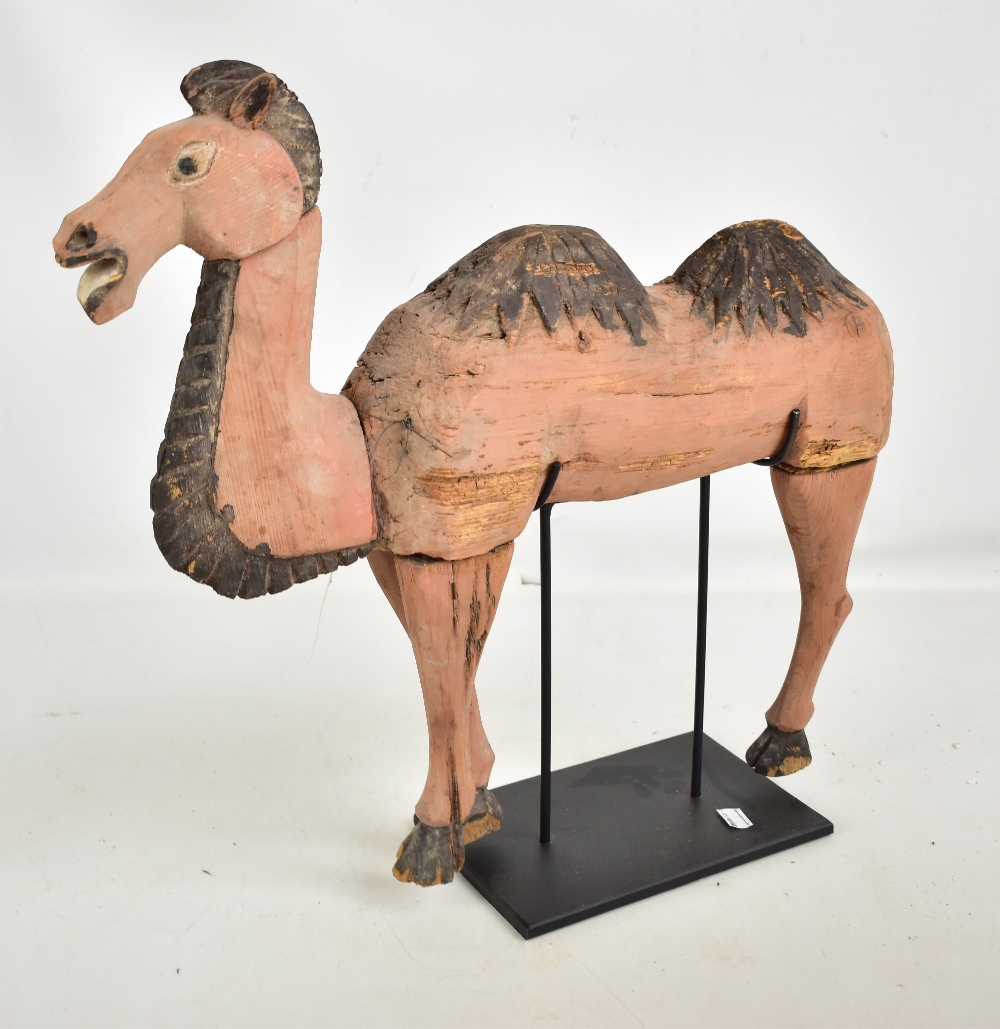 A Chinese carved wooden figure of a camel, northern Wei-Sui, some parts 300-500 AD with some more - Image 4 of 5