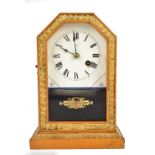 A late 19th century American mantel clock, the circular dial set with Roman numerals, housed