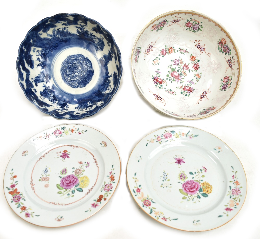 Two 18th century Chinese porcelain Famille Rose plates, each painted in enamels with floral