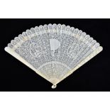 A late 19th century Chinese Export carved ivory brisé fan, the outer sticks featuring well carved