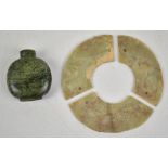 A sectional Chinese jade bi disc, each section with drilled holes for linking together, circa 2nd-