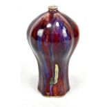 An 18th century Chinese flambé glazed vase of lobed form with rich red ground and blue/purple hue