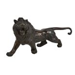 A large 20th century Japanese bronze figure of a lion standing for square, unmarked, length 44cm.