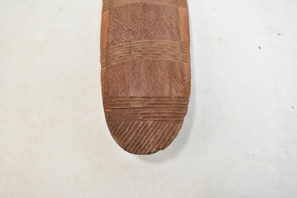 A mid-20th century Northern Australian parrying shield with bands of simple carved decoration, - Image 9 of 11