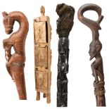 A tall ebonised carved African sectional staff, height approx 180cm, two walking sticks, length 84cm
