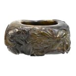 A rectangular Chinese hardstone ink pot with carved floral detail throughout, length 7cm.