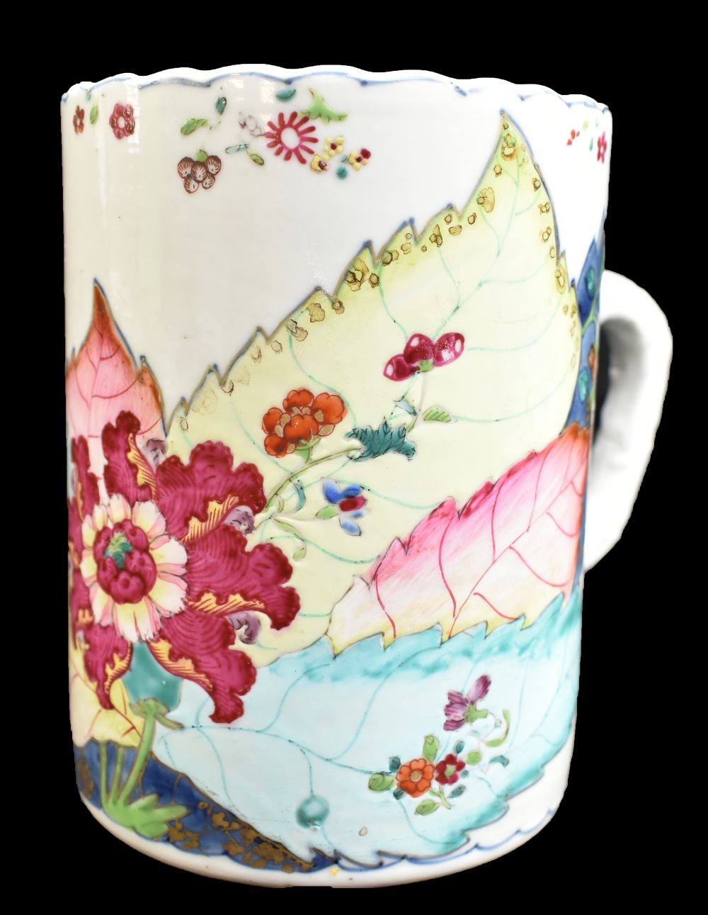 An 18th century Chinese porcelain Famille Rose mug, painted in enamels with floral decoration,