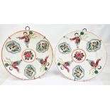 A pair of 20th century Southeast Asian porcelain plates decorated in enamels with boy in robes