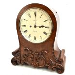 ADAMS OF LONDON; a 19th century pollard oak mantel clock, the circular dial set Roman numerals, with