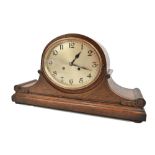 JUNGHANS OF WURTTENBERG; an early 20th century oak cased mantel clock with carved and beaded detail,
