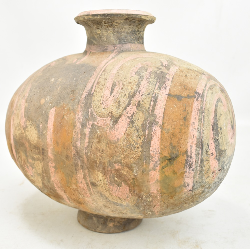 A Chinese Han dynasty earthenware cocoon vase with simple painted stylised detail on circular - Image 2 of 10