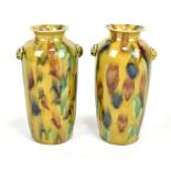 A pair of 19th century Chinese mottled tortoise shell glazed vases with applied masks beneath the