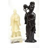 A 20th century Chinese carved soapstone figure depicting a robed official or poet on square