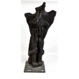 A large Sepik abstract carved seated figure on base, height 8cm.