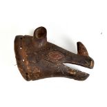 An African tribal mask in the form of a rhinoceros head, with pierced section to the collar,