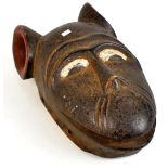 An unusual African tribal mask with painted detail and exaggerated ears, length 29cm.Additional