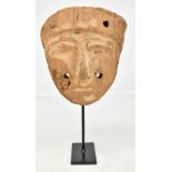 An Egyptian carved wooden mask now mounted with metal stand, mask height 23cm.Additional