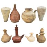 Eight 4th-1st century BC Cretan vessels including ewers and a pair of cone shaped vessels.Additional