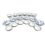 A set of six Japanese porcelain blue and white tea bowls, covers and saucers, painted with landscape