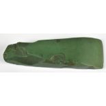 A Maori green stone adze, length 9.5cm, previously dated as being circa 1830.