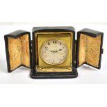 ZENITH WATCH COMPANY; a 19th century brass cased travelling alarm clock, the circular dial set