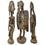 A large African carved figure with pronounced coiffure, height 63cm, a Bamana-type stylised bird