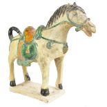 A Chinese sancai glazed pottery model of a saddled donkey, height 25cm, with label inscribed '
