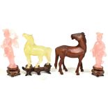 A pair of Chinese rose quartz coloured figures on stand (af), a carved hardstone figure of a horse