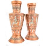 A pair of early 20th century Cairo Ware copper vases with white metal inlay featuring Ancient