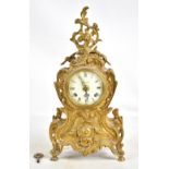IMPERIAL; a reproduction gilt metal mantel clock, with pierced ornate decoration throughout, with