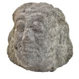 A large South East Asian carved rock fragmentary bust, width 37cm, height 3cm.Additional