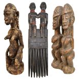 An African tribal carved double figure group, height 26cm, a carved double figure, length 40cm,