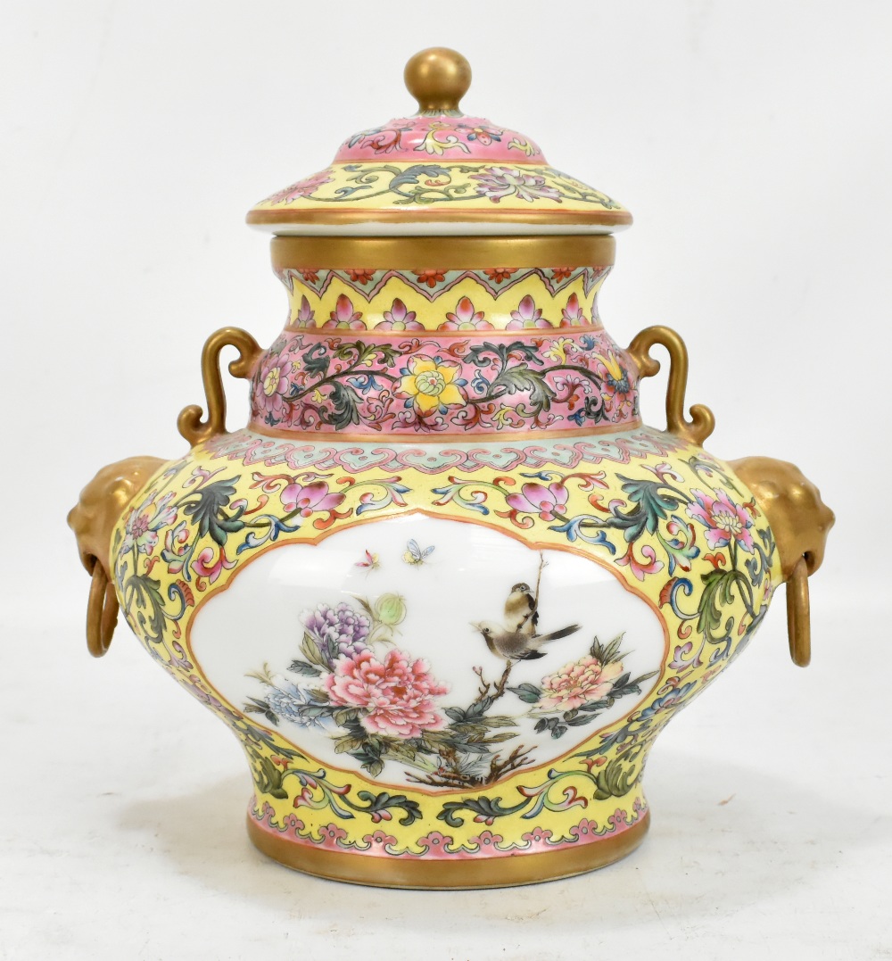 A 20th century Chinese lidded porcelain vase/vessel with twin gilt mask and loop handles featuring