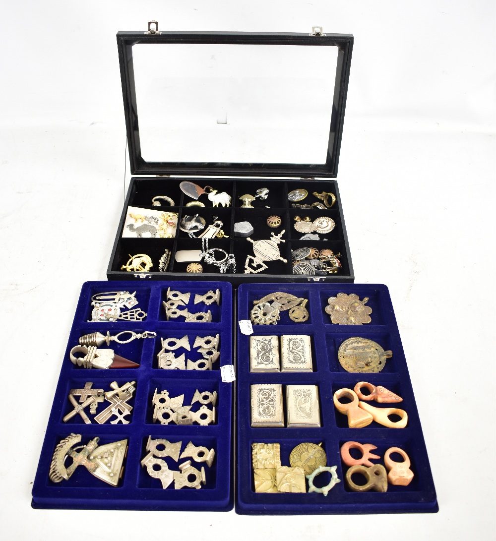 A quantity of African tribal jewellery including pendants and rings, some Tuareg examples, some