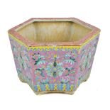 A 20th century Chinese porcelain hexagonal planter with Greek Key border to rim above enamelled