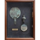 A framed and glazed display of a first millennium BC Hindu-Kush Bactrian bronze lady's toiletry set,