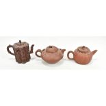 Three 20th century Chinese Yixing teapots, one with reticulated detail, height 12cm, all unmarked (