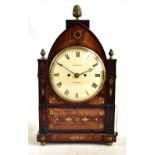 OSMOND OF TISBURY; a Regency mahogany brass inlaid lancet top mantel clock, the circular dial with