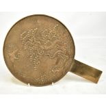 A late 19th/early 20th century Chinese 'magic' bronze mirror decorated with landscape featuring