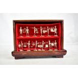 A cased set of twelve Chinese (or Hong Kong) sterling silver menu holders modelled as traditional