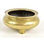 A 19th century Chinese bronze censer raised on three feet with apocryphal four character Xuande mark