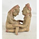 A pre-Columbian type erotic figure group with coloured detail, height 18cm (af). Additional
