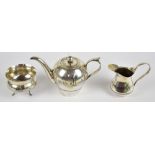 An early 20th century Iraqi silver and niello enamel three piece tea service with typical