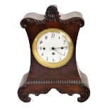A William IV mahogany mantel clock, with carved detail surrounding the circular enamelled dial set