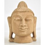 An Indonesian volcanic stone head of Buddha, height 20cm. Provenance: From a private collection in