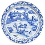 An early 20th century Chinese blue and white porcelain plate with scalloped edge, painted with